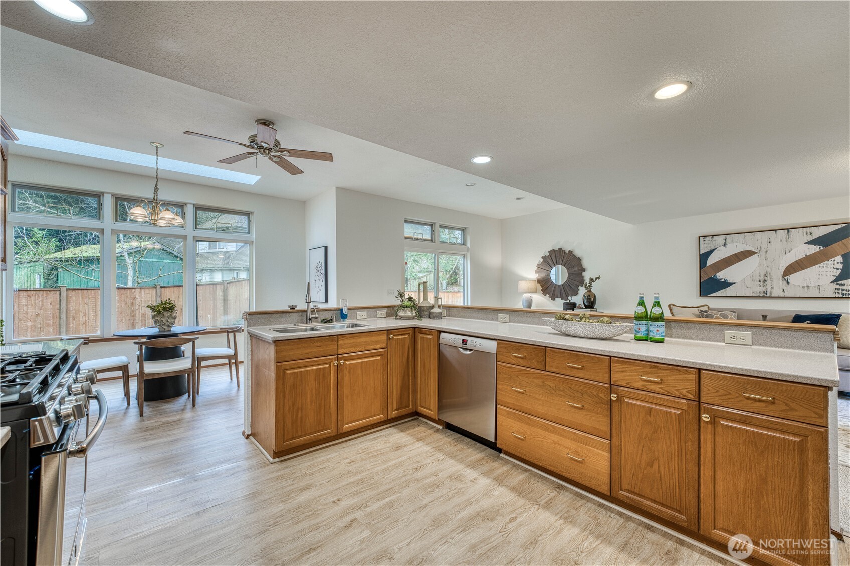 23823 90th Place West Edmonds, WA 98026 - Photo 19 of 40 a kitchen with stainless steel appliances granite countertop a sink dishwasher stove and refrigerator