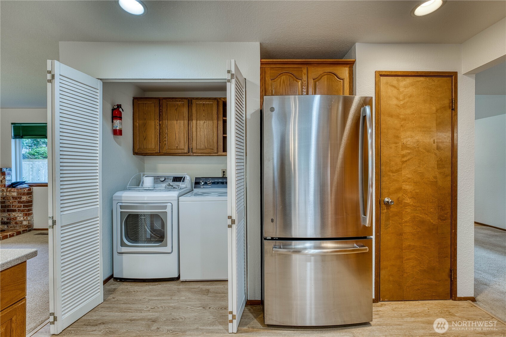 23823 90th Place West Edmonds, WA 98026 - Photo 20 of 40 a white refrigerator freezer and a stove sitting inside of a kitchen