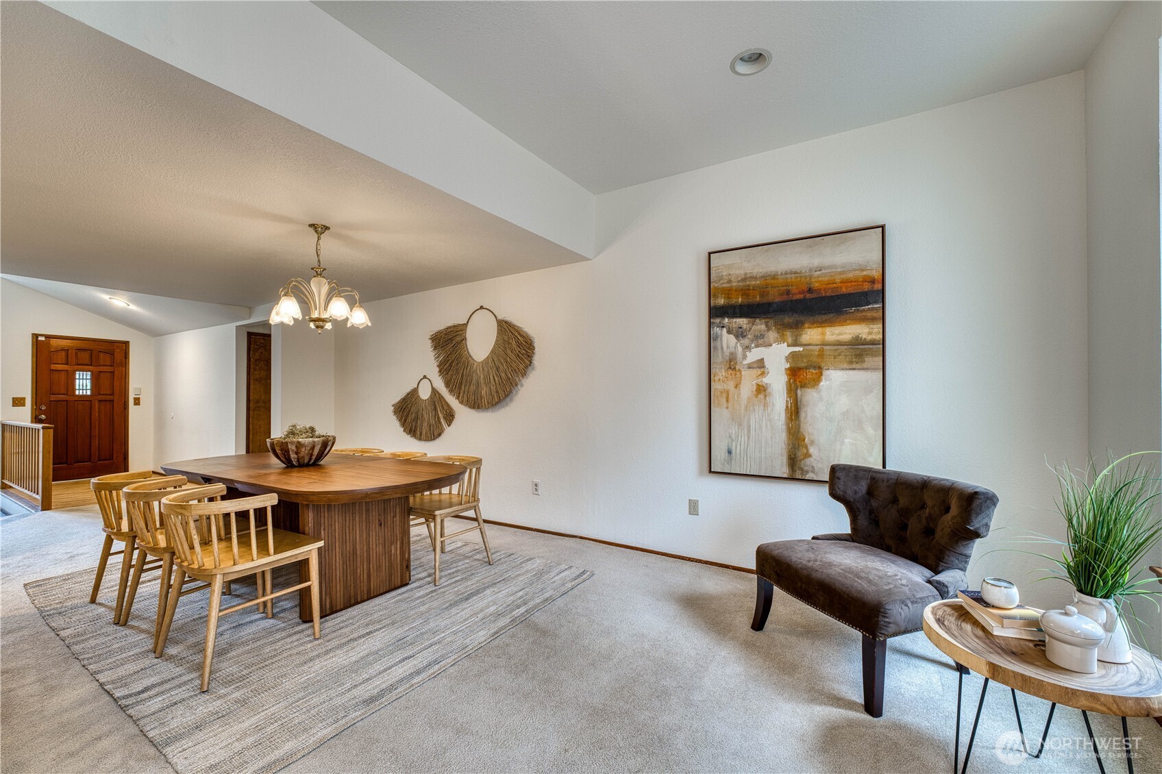 23823 90th Place West Edmonds, WA 98026 - Photo 23 of 40 a living room with furniture a dining table a lamp and a large window
