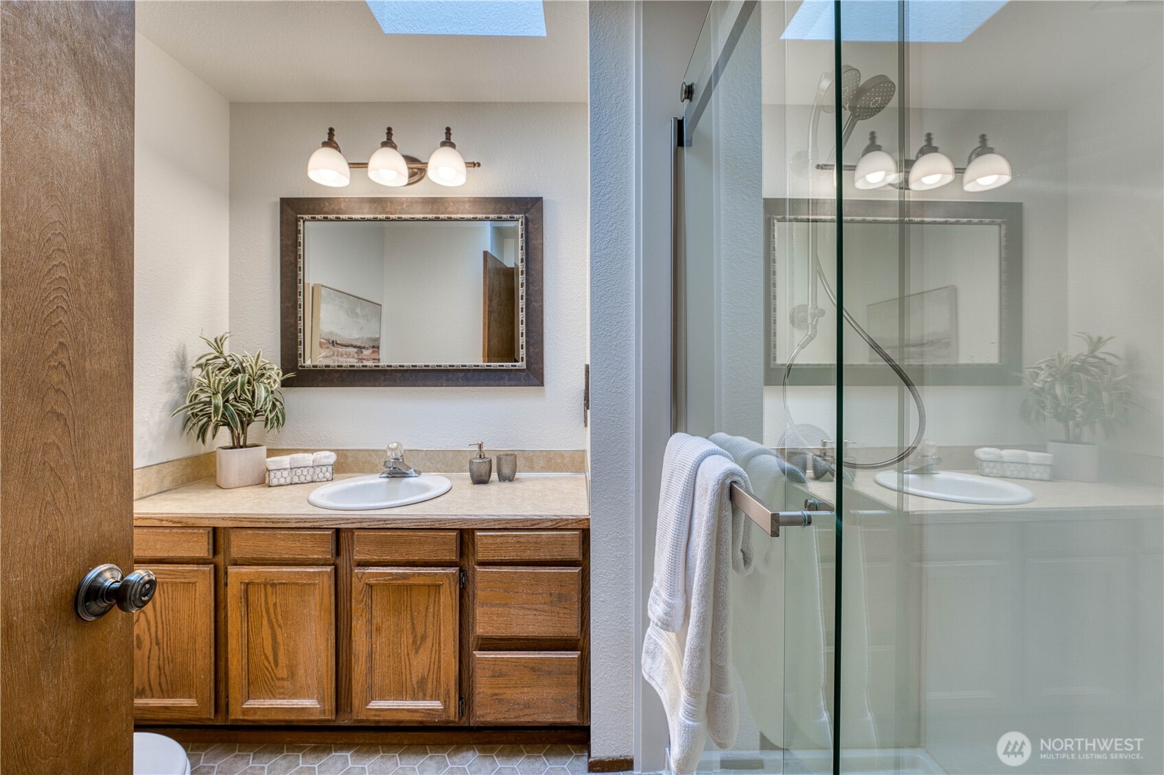23823 90th Place West Edmonds, WA 98026 - Photo 25 of 40 a bathroom with a sink a mirror and vanity