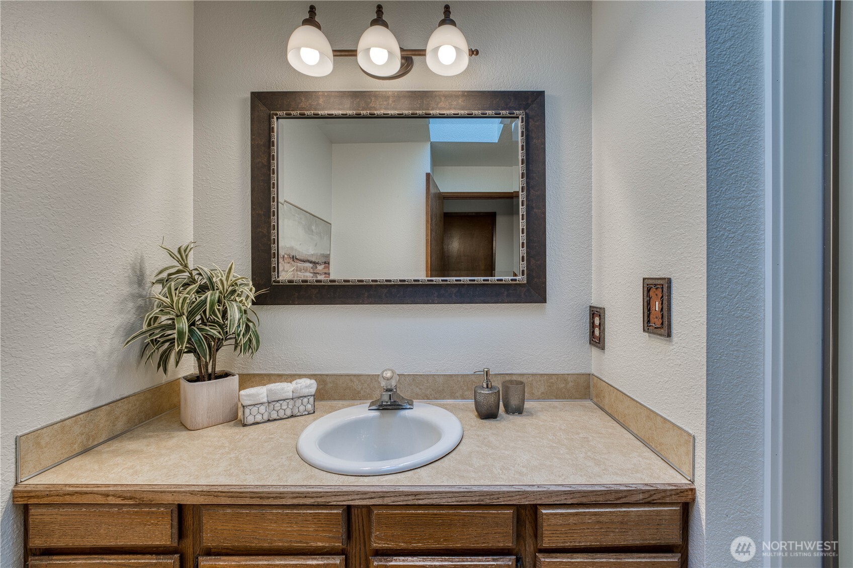 23823 90th Place West Edmonds, WA 98026 - Photo 26 of 40 a bathroom with a sink and a mirror