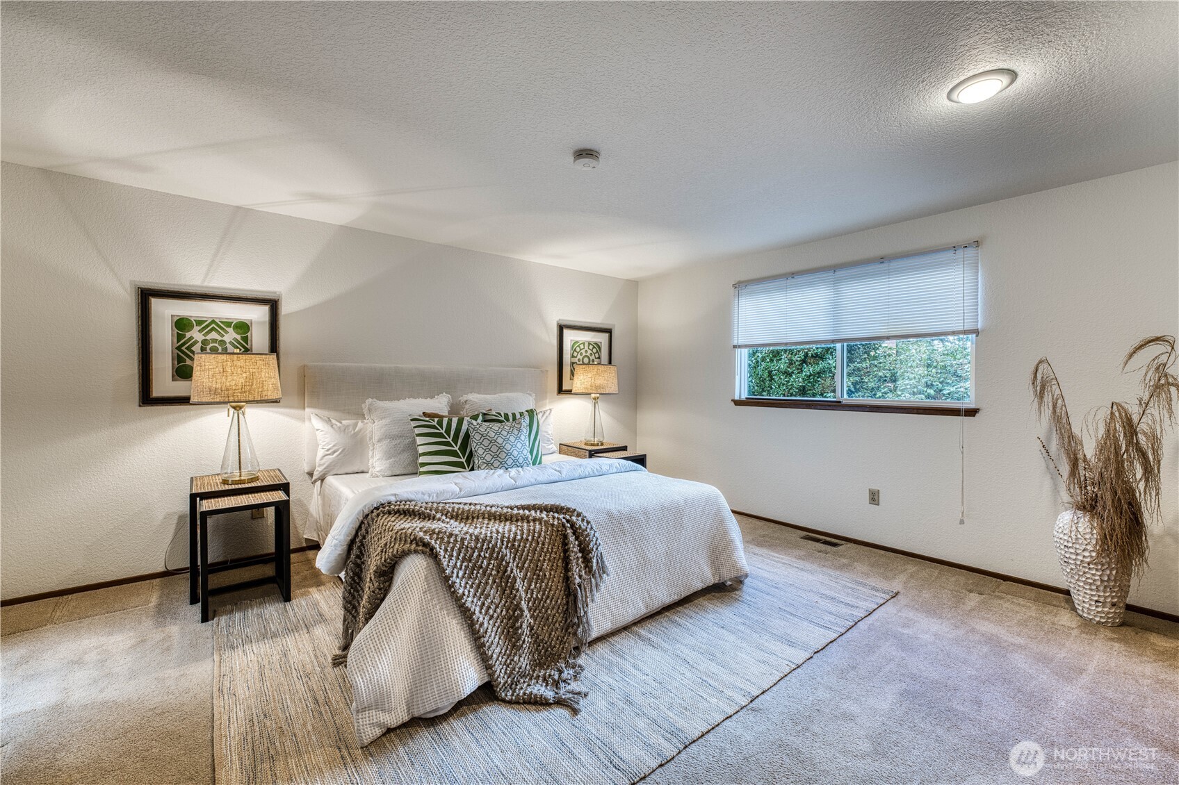 23823 90th Place West Edmonds, WA 98026 - Photo 27 of 40 a spacious bedroom with a bed and a window