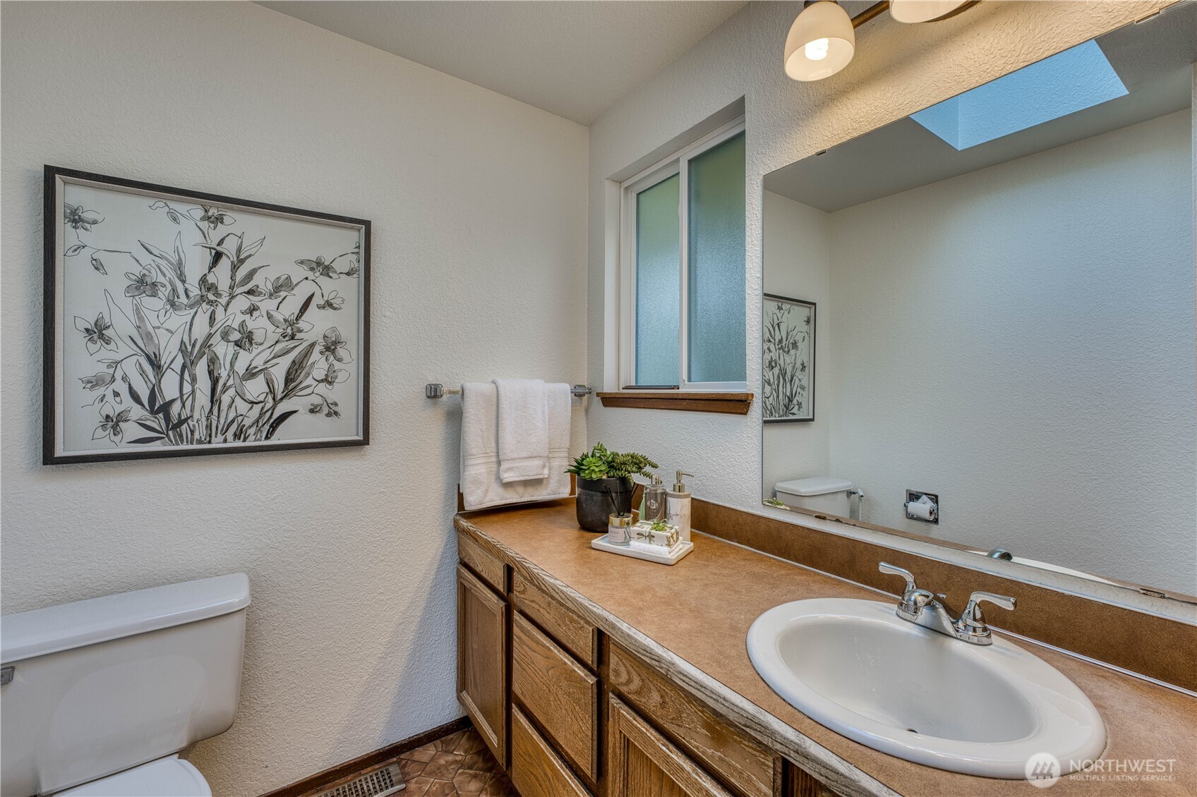 23823 90th Place West Edmonds, WA 98026 - Photo 29 of 40 a bathroom with a sink and a mirror
