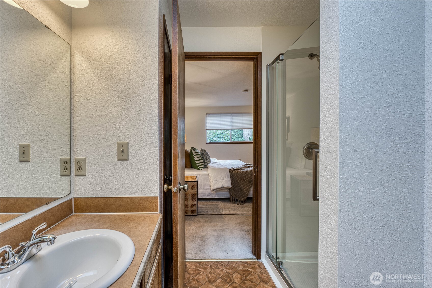 23823 90th Place West Edmonds, WA 98026 - Photo 30 of 40 a en suite bathroom with a granite countertop tub sink and mirror