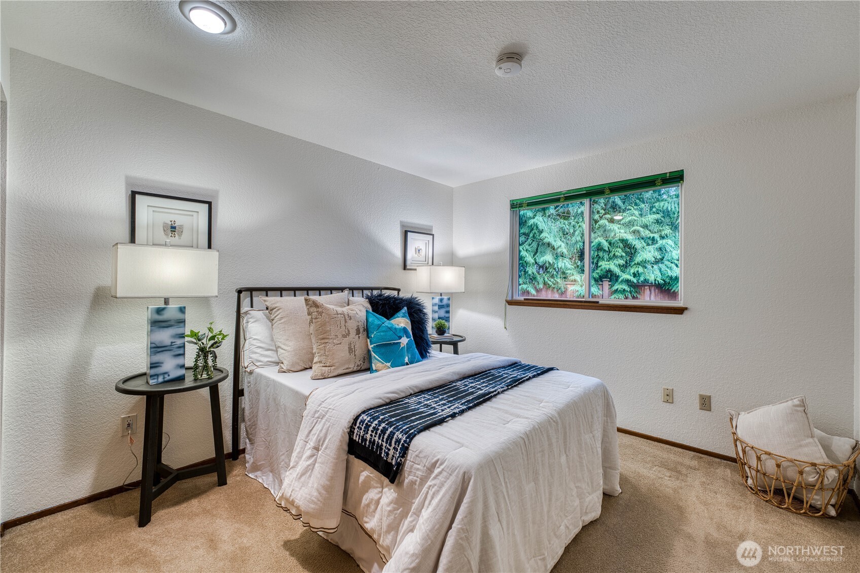 23823 90th Place West Edmonds, WA 98026 - Photo 32 of 40 a bedroom with a bed and a lamp