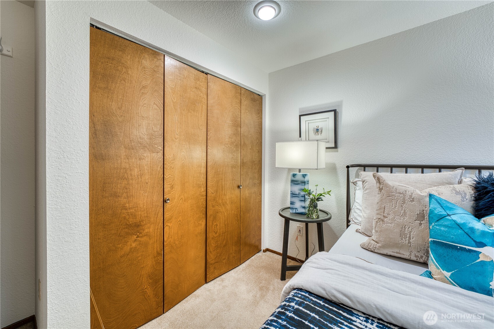 23823 90th Place West Edmonds, WA 98026 - Photo 33 of 40 a bedroom with a bed and wooden floor