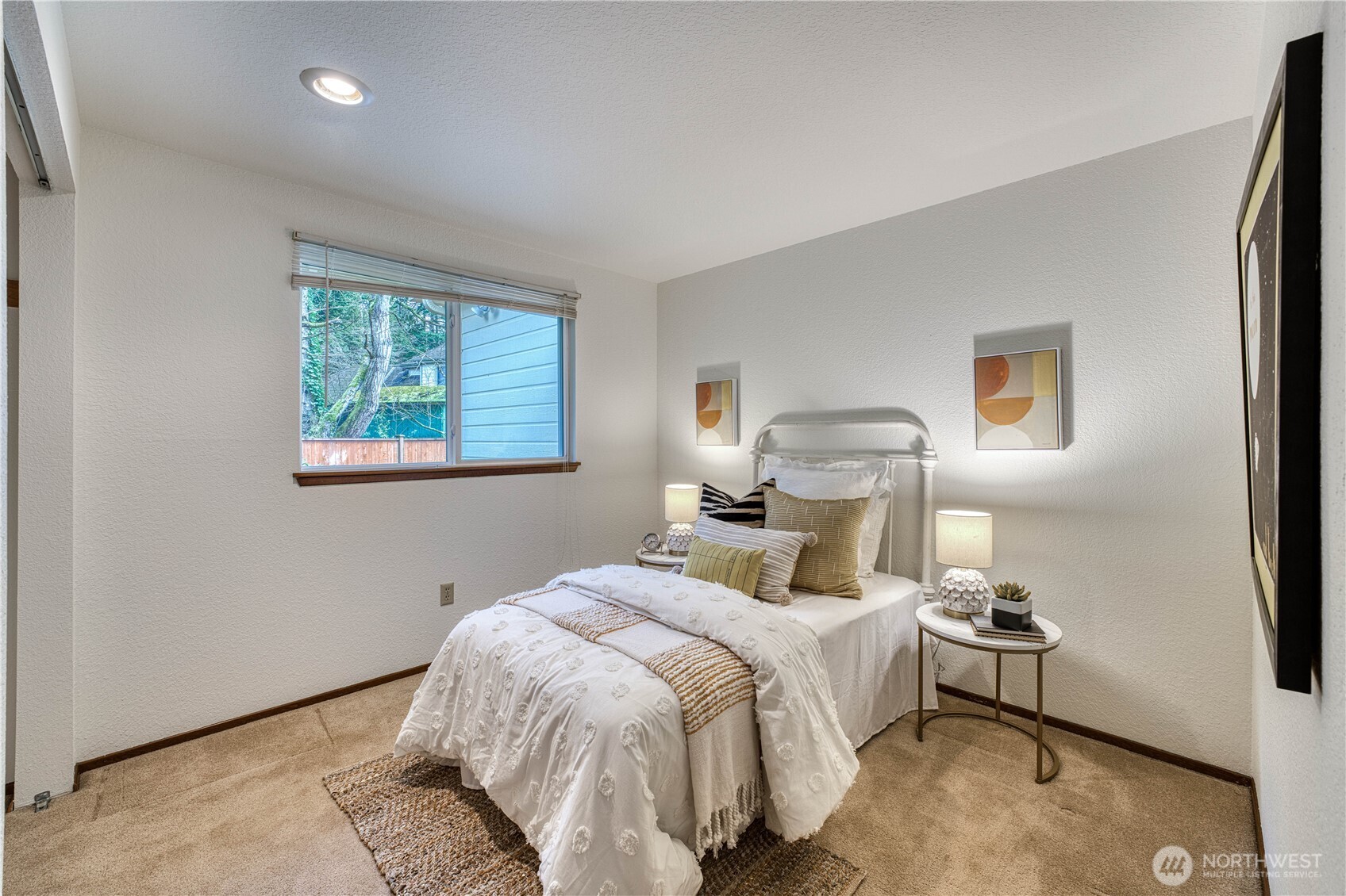23823 90th Place West Edmonds, WA 98026 - Photo 34 of 40 a bedroom with a bed and a painting on the wall