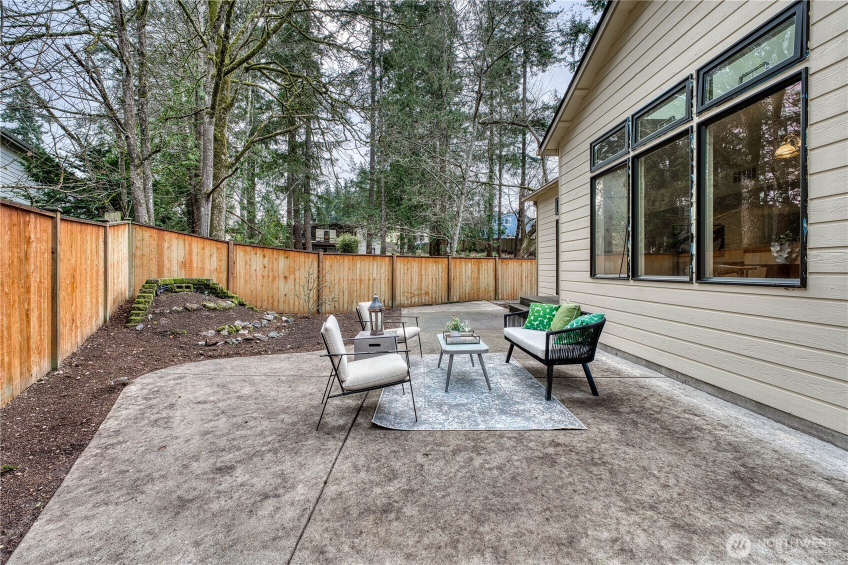 23823 90th Place West Edmonds, WA 98026 - Photo 38 of 40 a view of a patio with couple of chairs and a fire pit