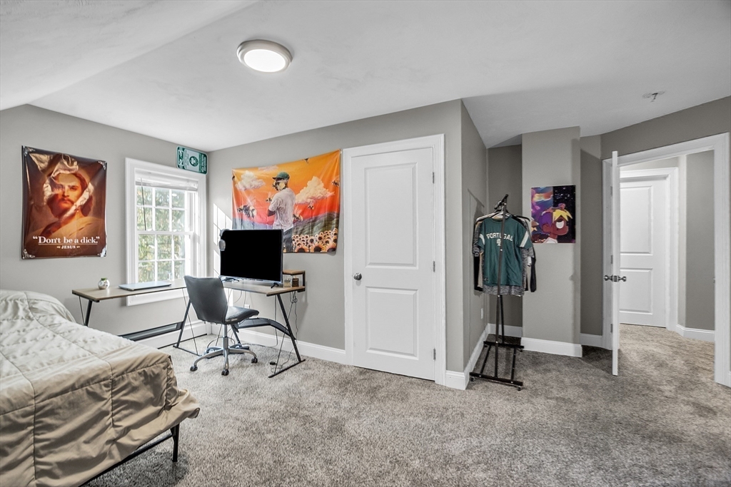 20 Main Street Ashburnham, MA 01430 - Photo 31 of 42 a living room with furniture a flat screen tv and a window