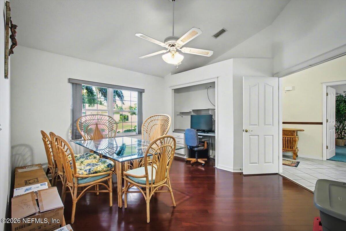 22 Farnum Lane Palm Coast, FL 32137 - Photo 11 of 17 a view of a dining room with furniture window and wooden floor