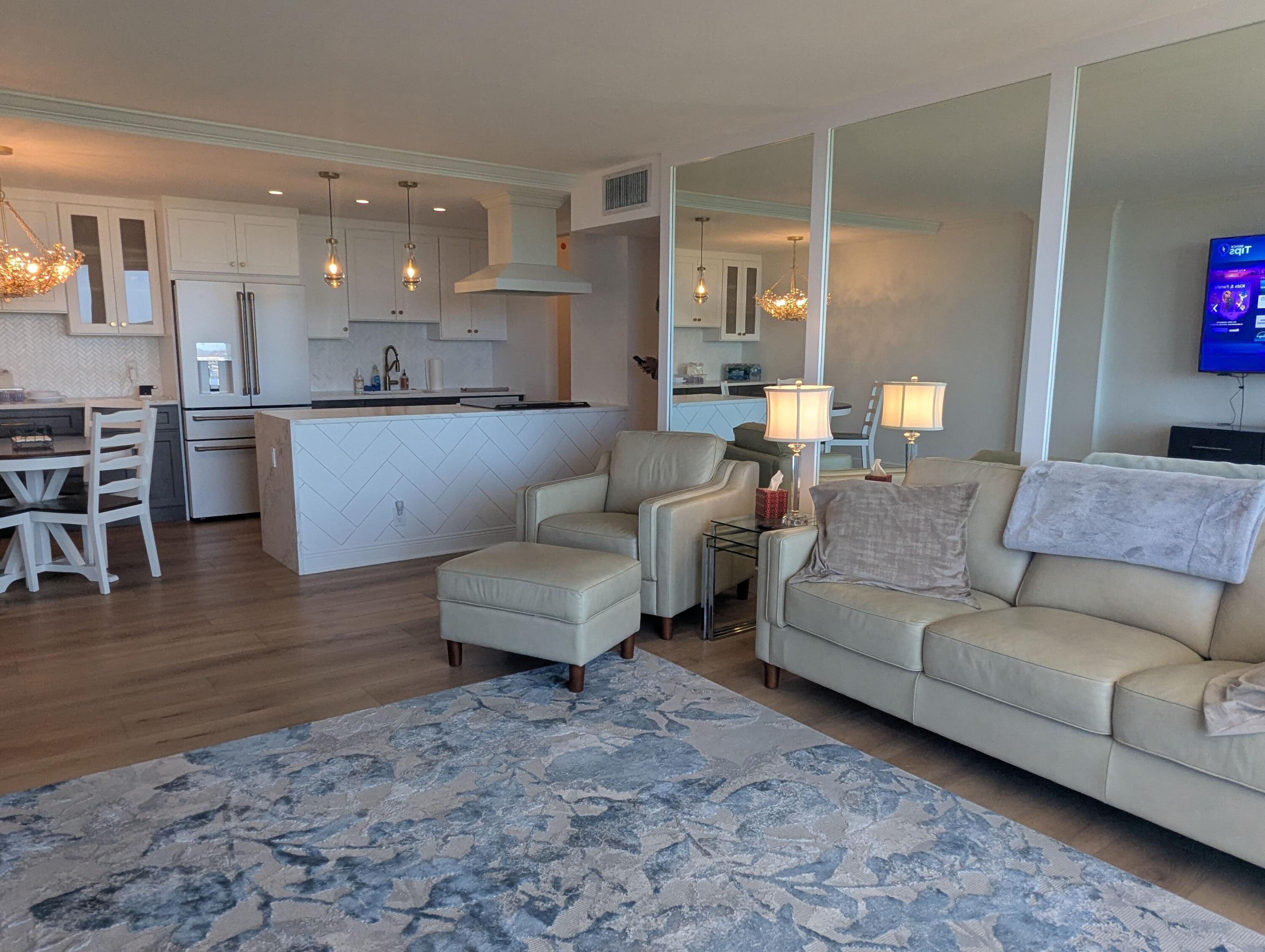 2121 North Ocean Boulevard, Unit 1006E Boca Raton, FL 33431 - Photo 13 of 64 a living room with furniture and kitchen view