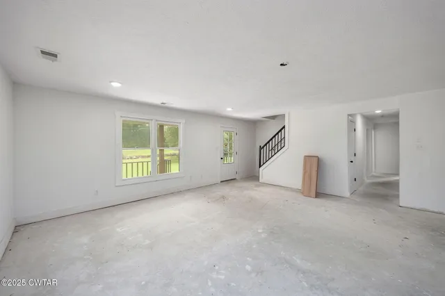 a view of an empty room with a window