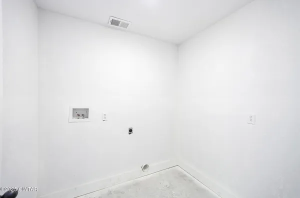 a bathroom with a sink a toilet and a window