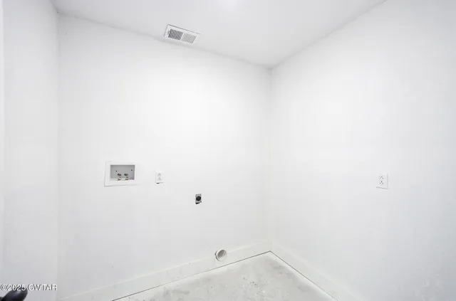 a bathroom with a sink a toilet and a window