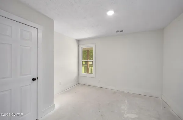 a view of livingroom with furniture and a window