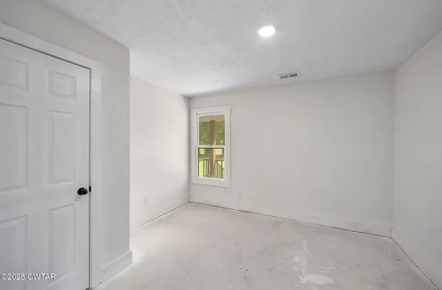a view of livingroom with furniture and a window