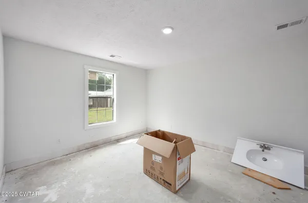 a view of bathroom with a sink and a mirror