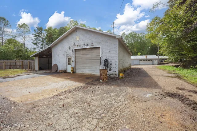 a living room with furniture a rug and a window