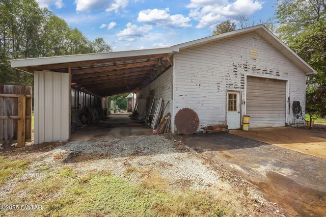a bathroom with a sink a toilet and shower curtain