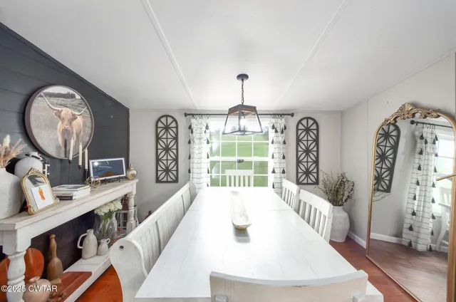a bathroom with a toilet sink and shower curtain