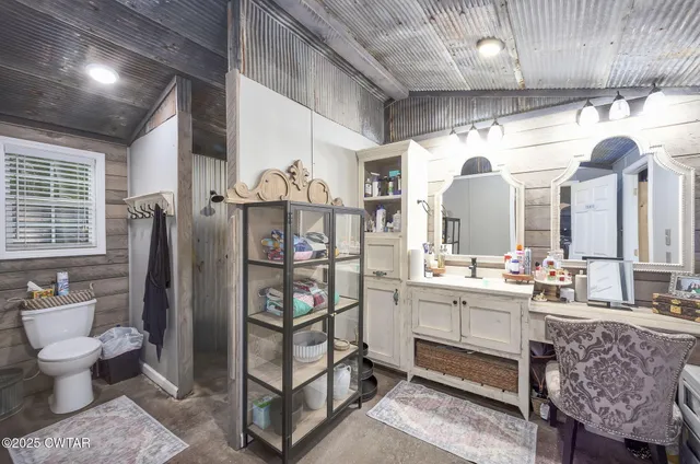 a view of a house with swimming pool and sitting area