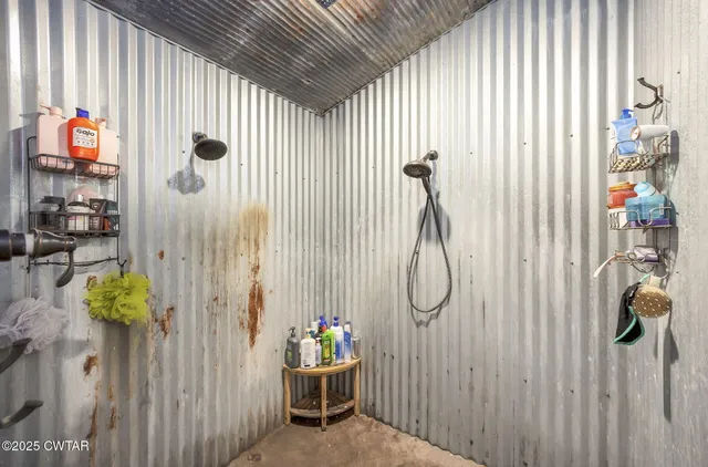 an aerial view of a houses with a yard