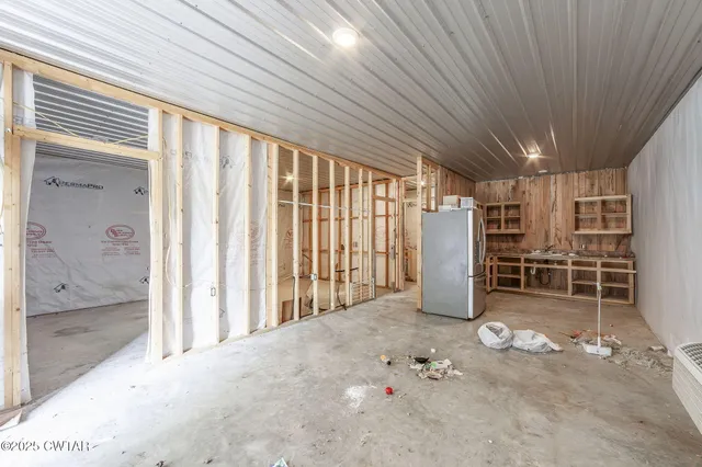 an aerial view of a house with swimming pool and porch