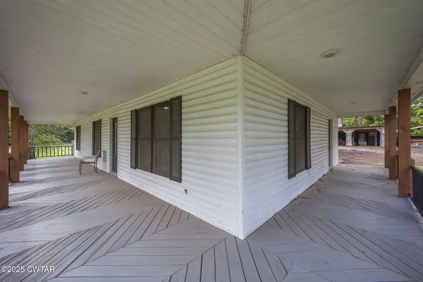 a view of a patio with wooden floor