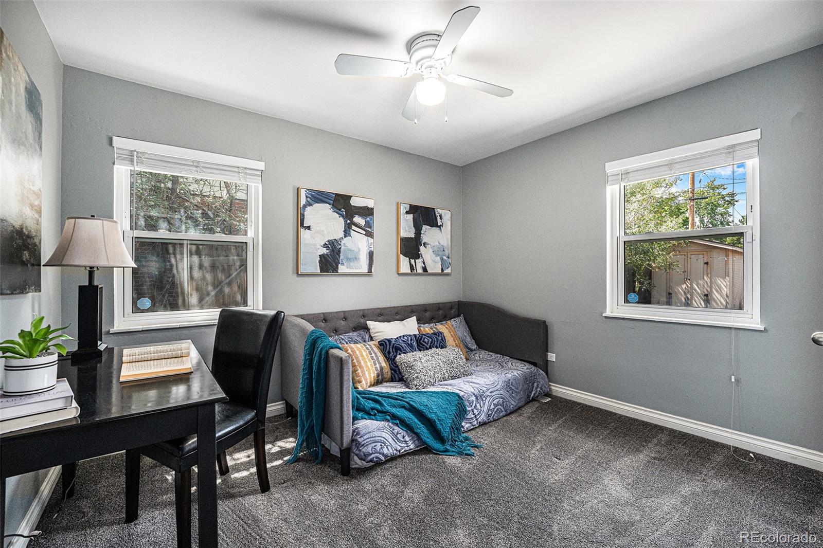 2141 Quebec Street Denver, CO 80207 - Photo 14 of 36 a bedroom with furniture and a window