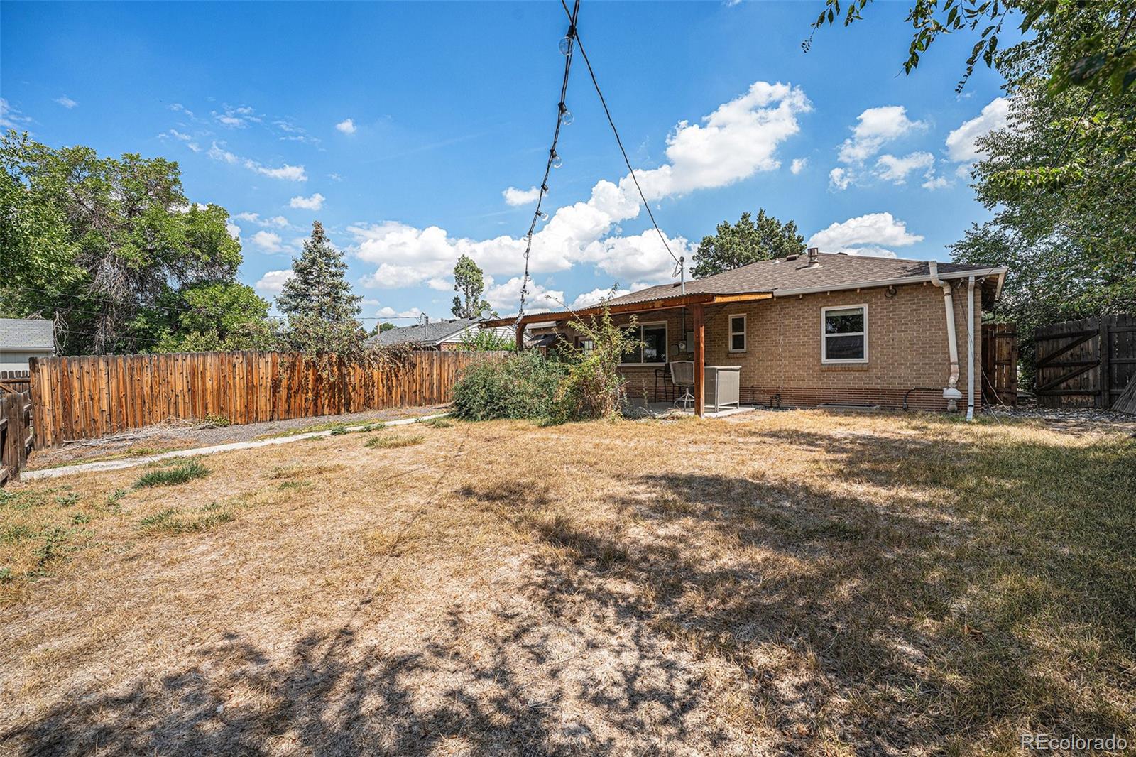 2141 Quebec Street Denver, CO 80207 - Photo 3 of 36 a view of a house with a yard
