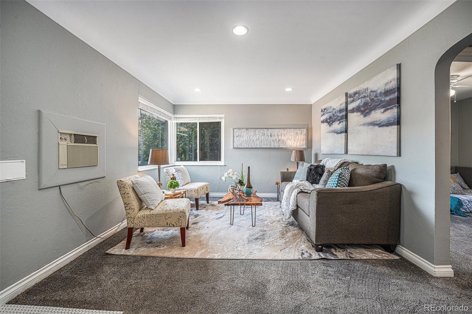 2141 Quebec Street Denver, CO 80207 - Photo 9 of 36 a living room with furniture and a couch