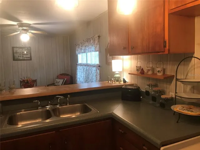 a kitchen with a sink and cabinets