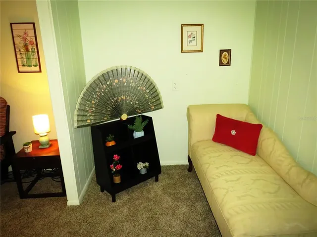 a view of a dining room with furniture and window