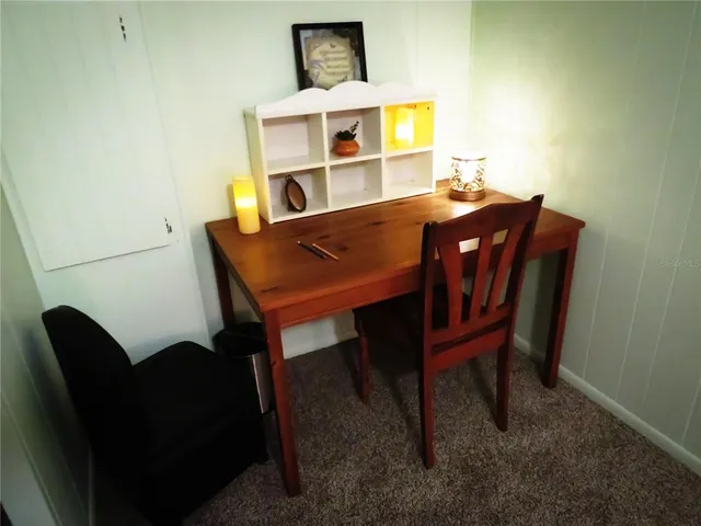 a bathroom with a sink vanity mirror and toilet