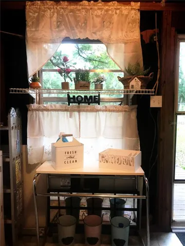 a view of a sign board with a floor to ceiling window