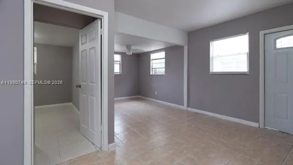 a view of an empty room with a window