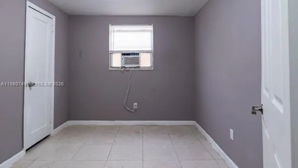 a kitchen with granite countertop wooden cabinets and white appliances