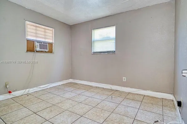 a view of a livingroom with an empty space and window