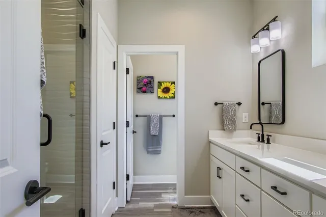 a bathroom with a double vanity sink and mirror