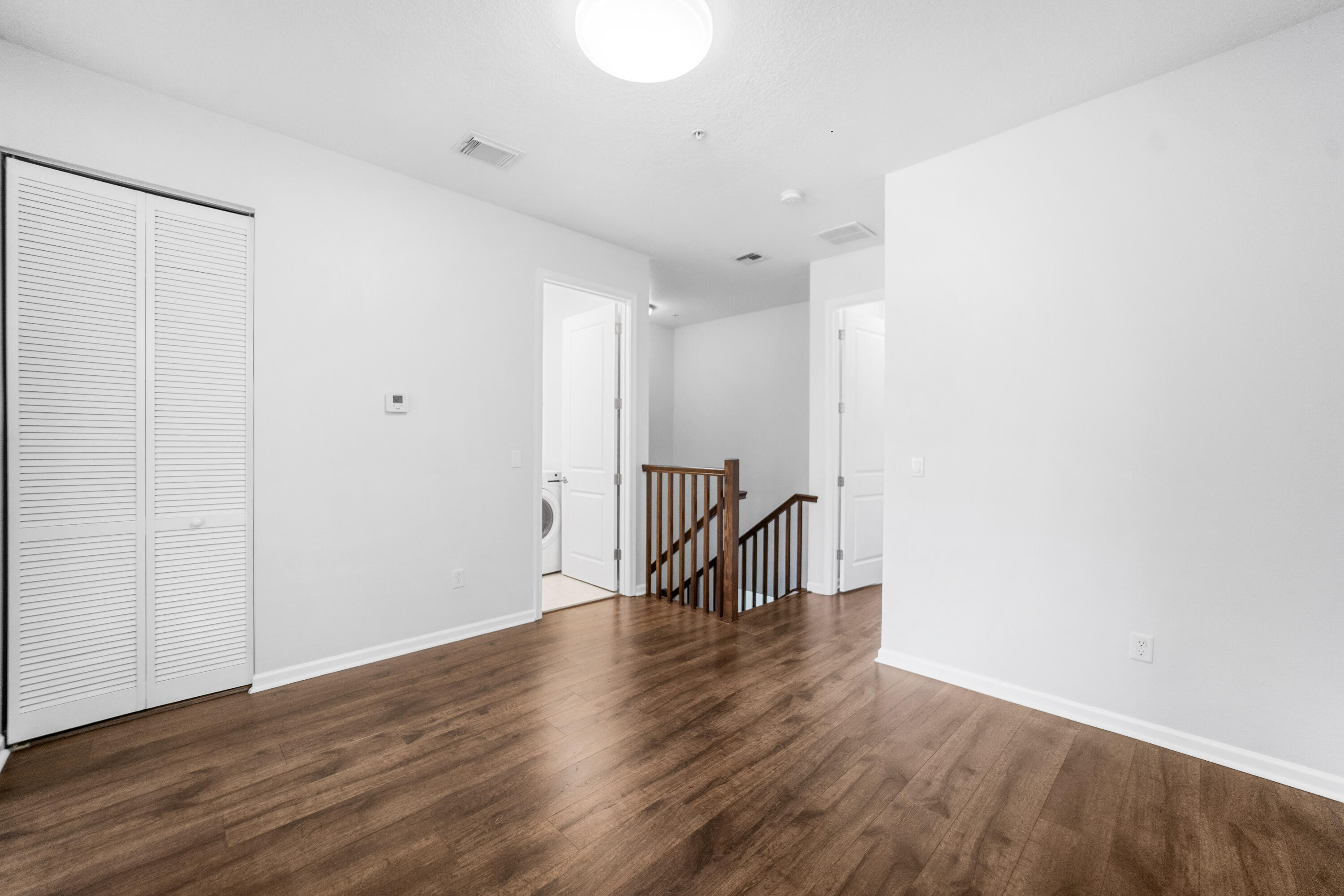 1430 Northwest 48th Lane Boca Raton, FL 33431 - Photo 17 of 54 a view of an empty room with wooden floor