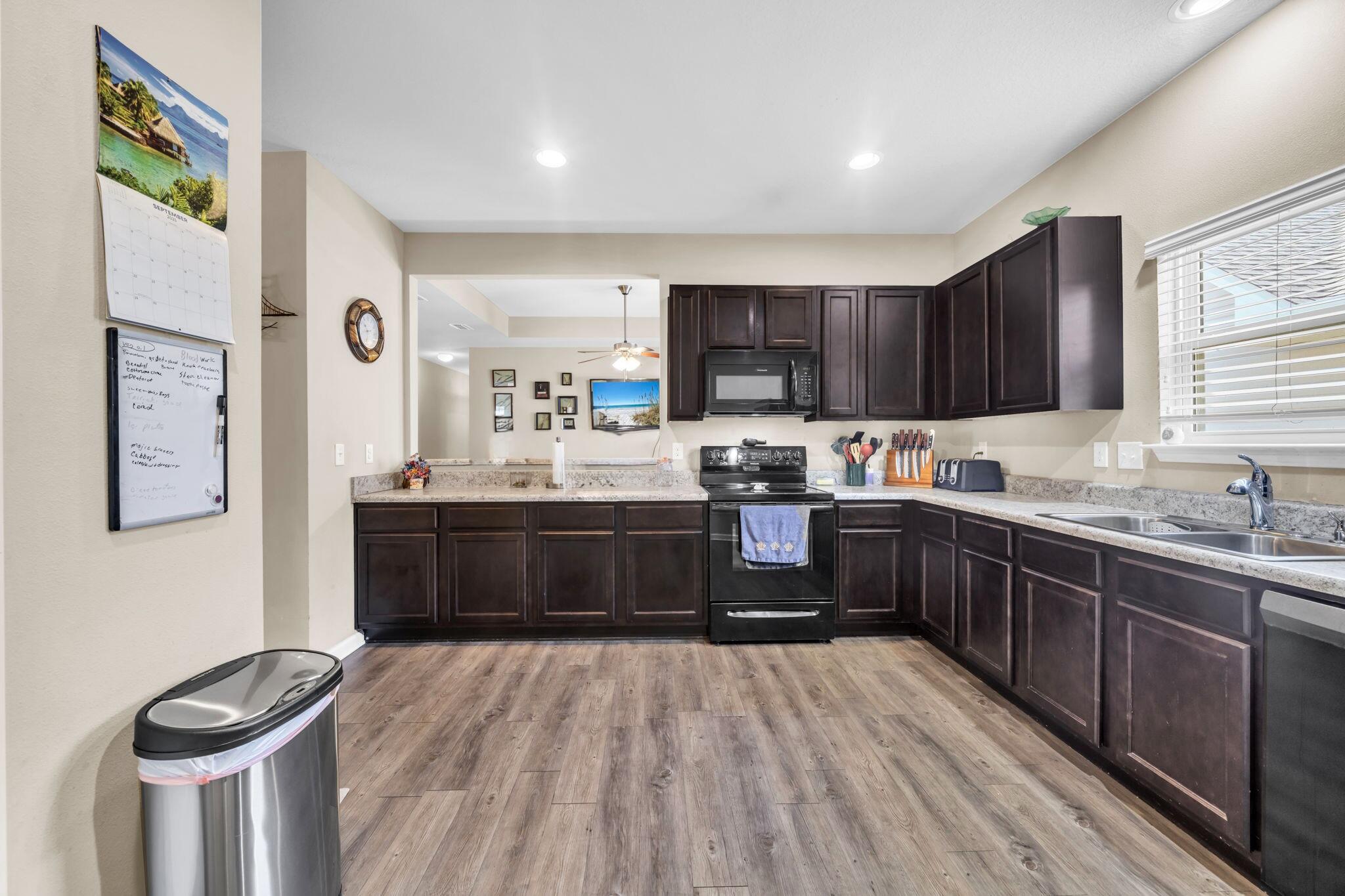 46 Cornelia Street Freeport, FL 32439 - Photo 13 of 49 a kitchen with stainless steel appliances a refrigerator sink and cabinets
