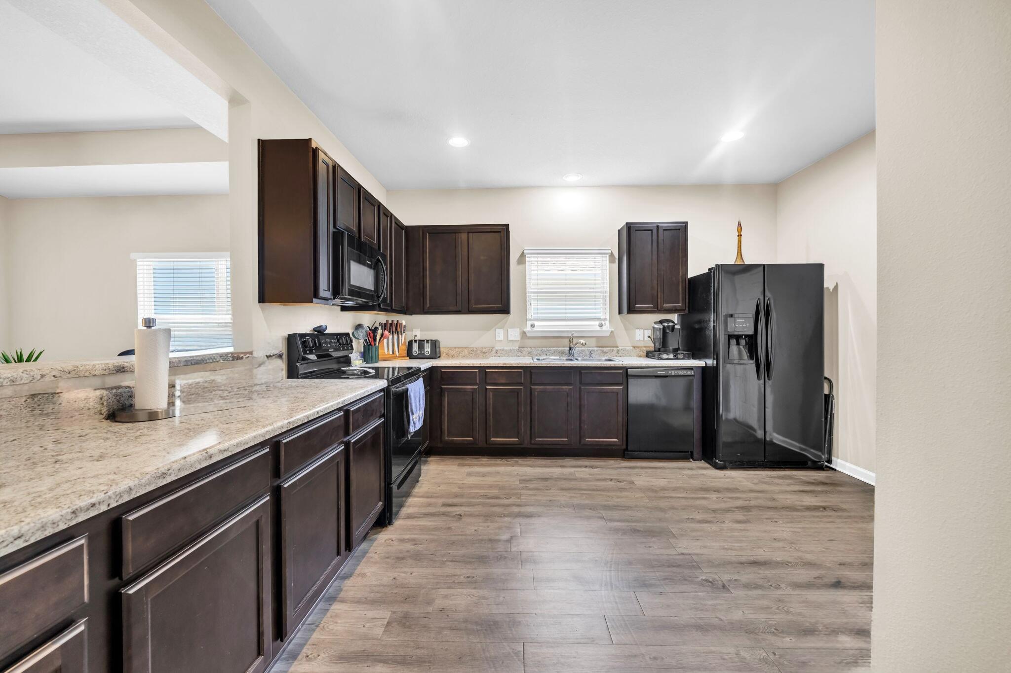 46 Cornelia Street Freeport, FL 32439 - Photo 14 of 49 a kitchen with stainless steel appliances a refrigerator sink and cabinets