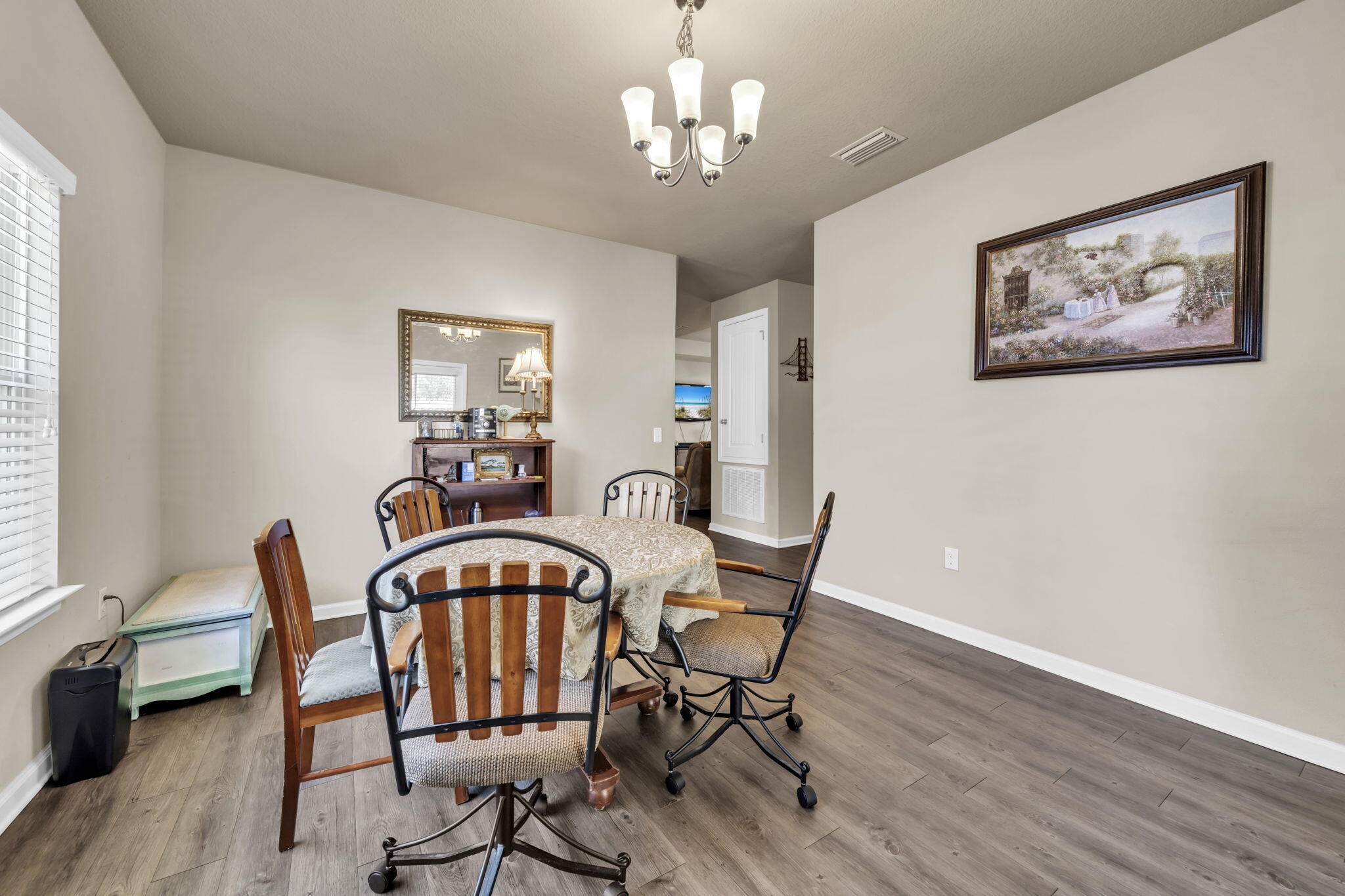46 Cornelia Street Freeport, FL 32439 - Photo 16 of 49 a view of a dining room with furniture window and wooden floor