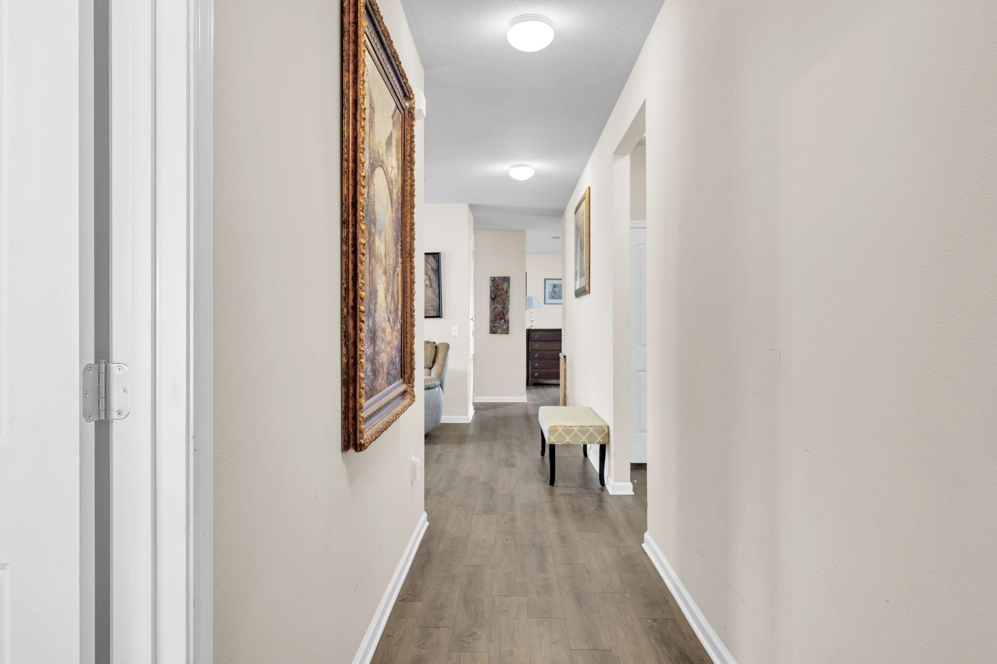 46 Cornelia Street Freeport, FL 32439 - Photo 2 of 49 a view of a hallway with wooden floor and staircase