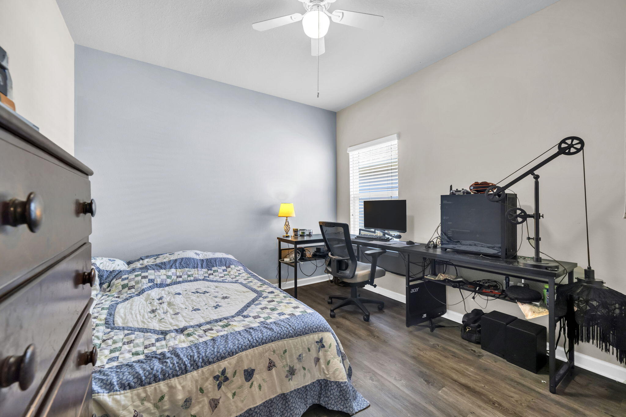 46 Cornelia Street Freeport, FL 32439 - Photo 22 of 49 a bedroom with a bed and a chandelier