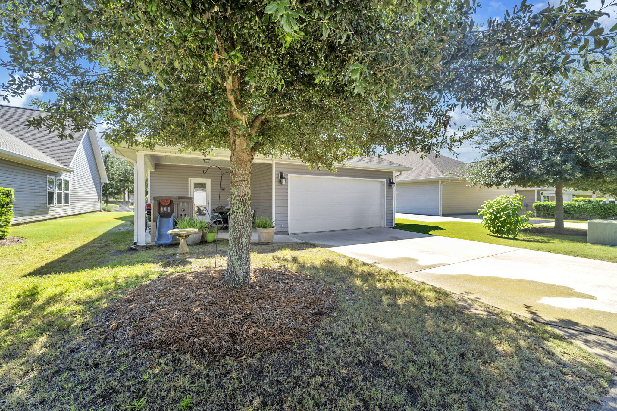 46 Cornelia Street Freeport, FL 32439 - Photo 26 of 49 a view of a house with backyard and sitting area