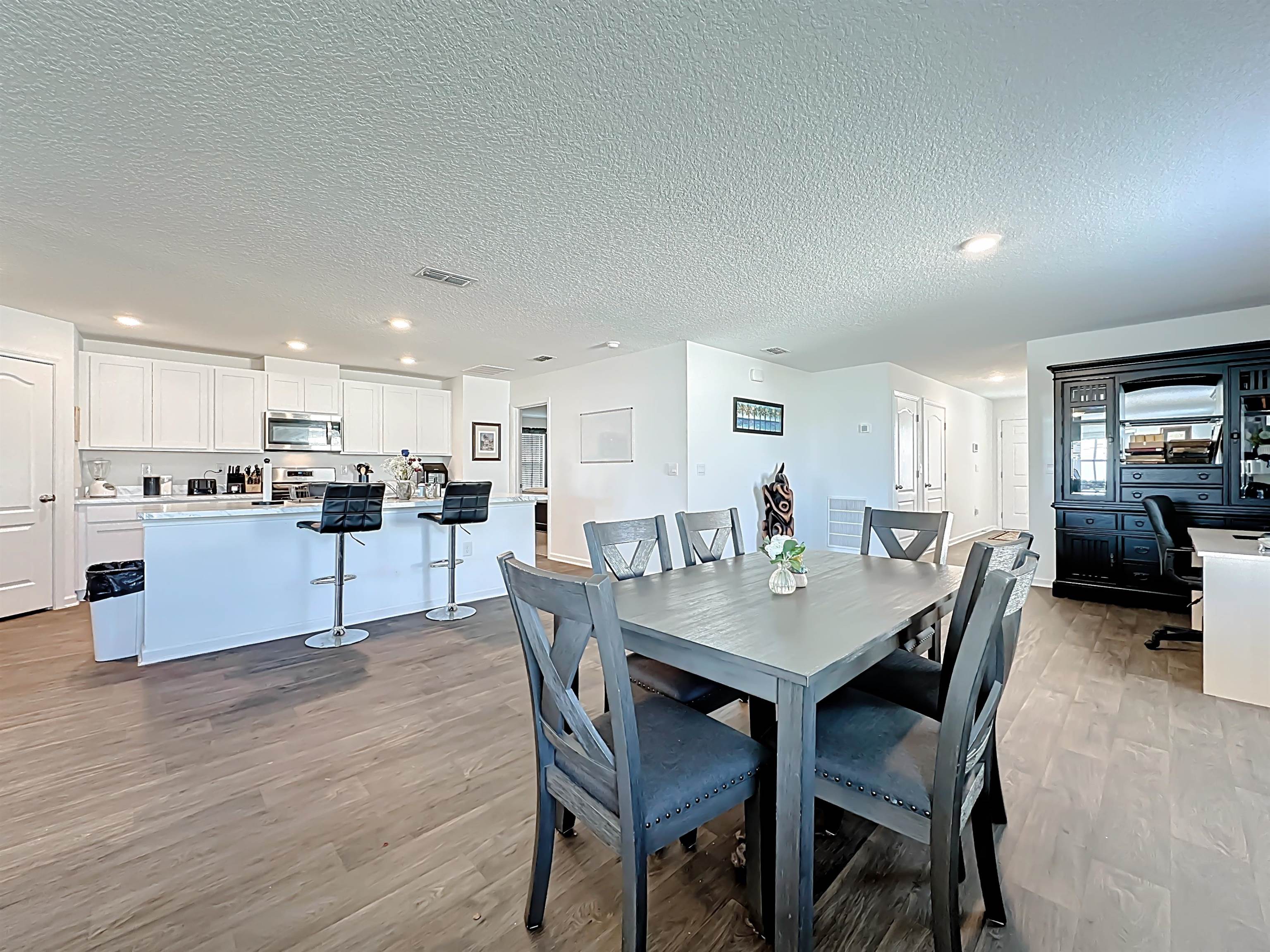 16 Encanto Way Street St. Augustine, FL 32084 - Photo 12 of 56 Dining space with a textured ceiling, light wood-style flooring, and recessed lighting