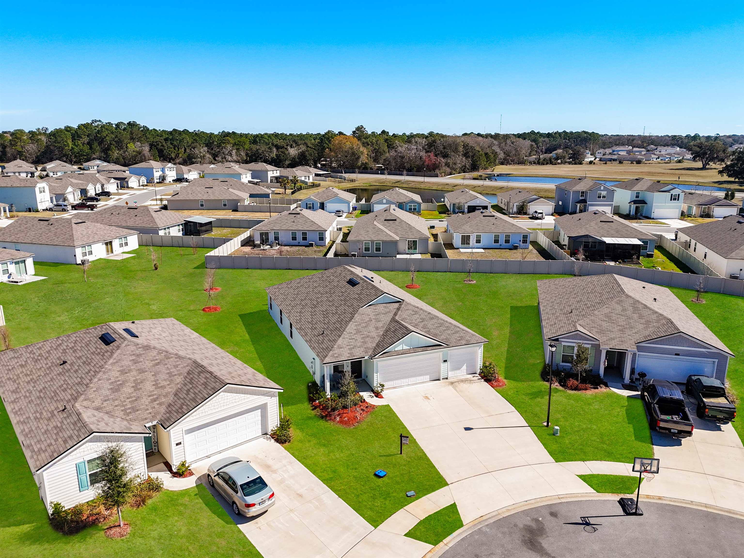 16 Encanto Way Street St. Augustine, FL 32084 - Photo 3 of 56 Aerial perspective of suburban area featuring a tree filled landscape