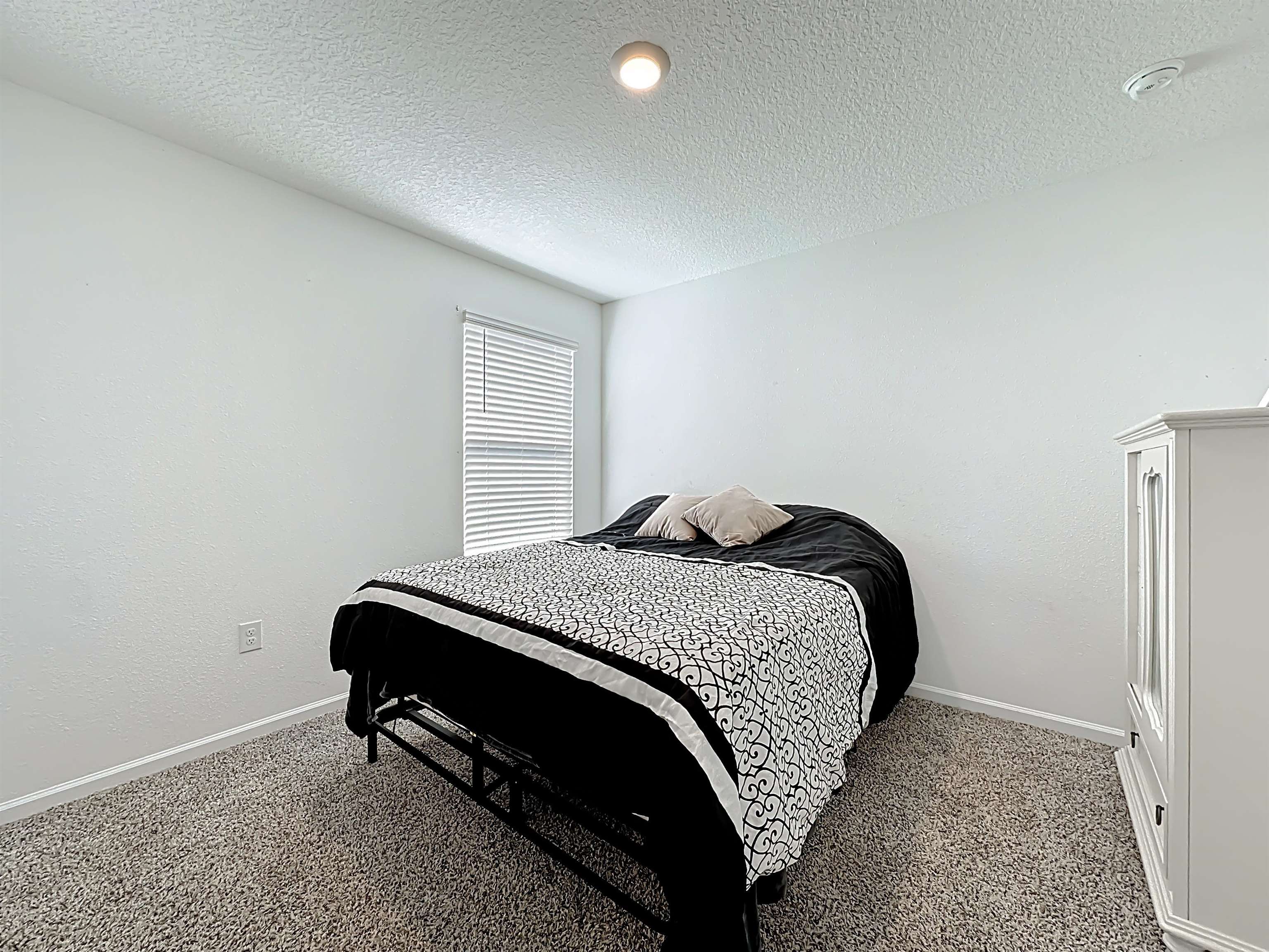 16 Encanto Way Street St. Augustine, FL 32084 - Photo 29 of 56 Carpeted bedroom featuring baseboards and a textured ceiling