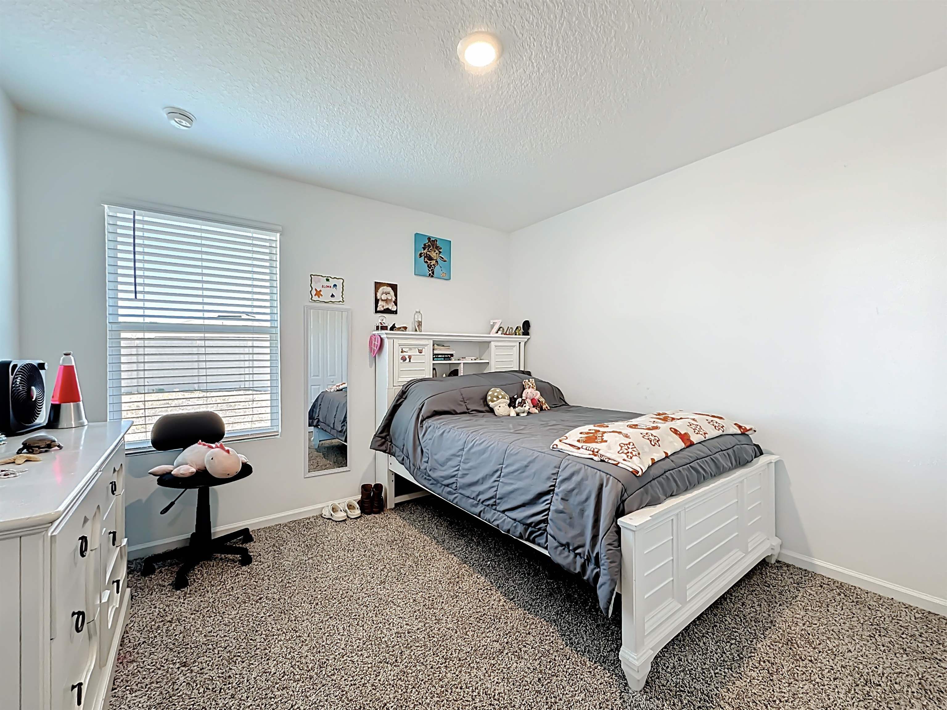 16 Encanto Way Street St. Augustine, FL 32084 - Photo 32 of 56 Carpeted bedroom with baseboards and a textured ceiling